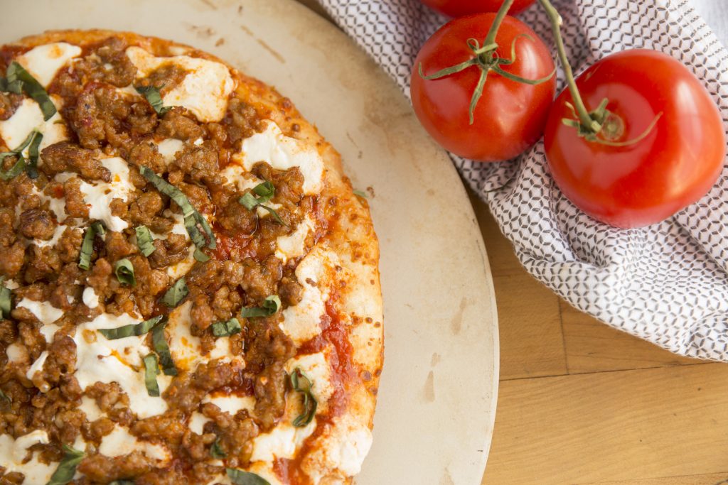 Homemade Pizza with Italian Sausage and Fresh Basil